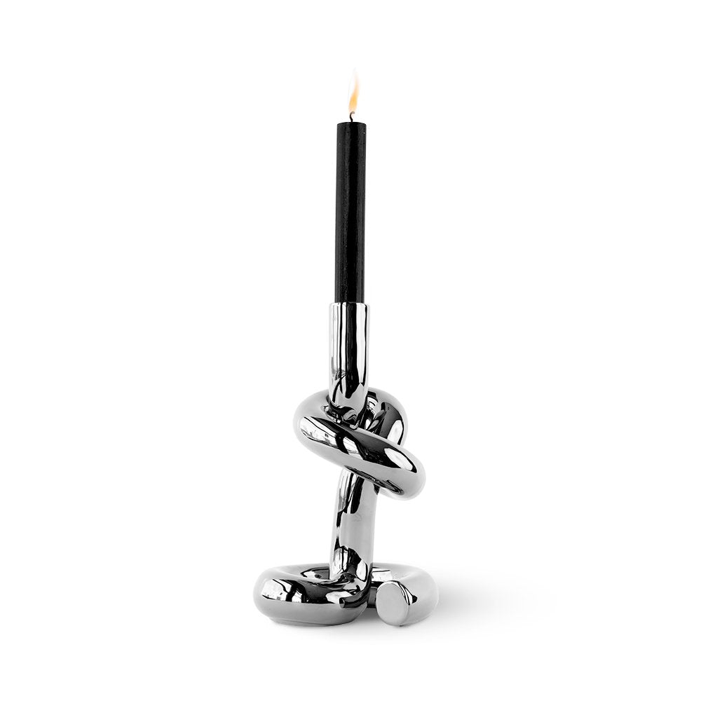 Candle holder with a knot design on a white background