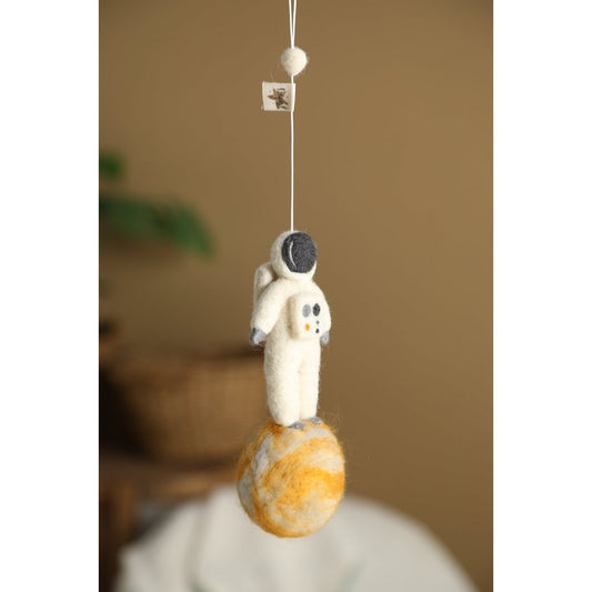 2 Stories Decorative hanging figure of a space-themed bunny on a brown background
