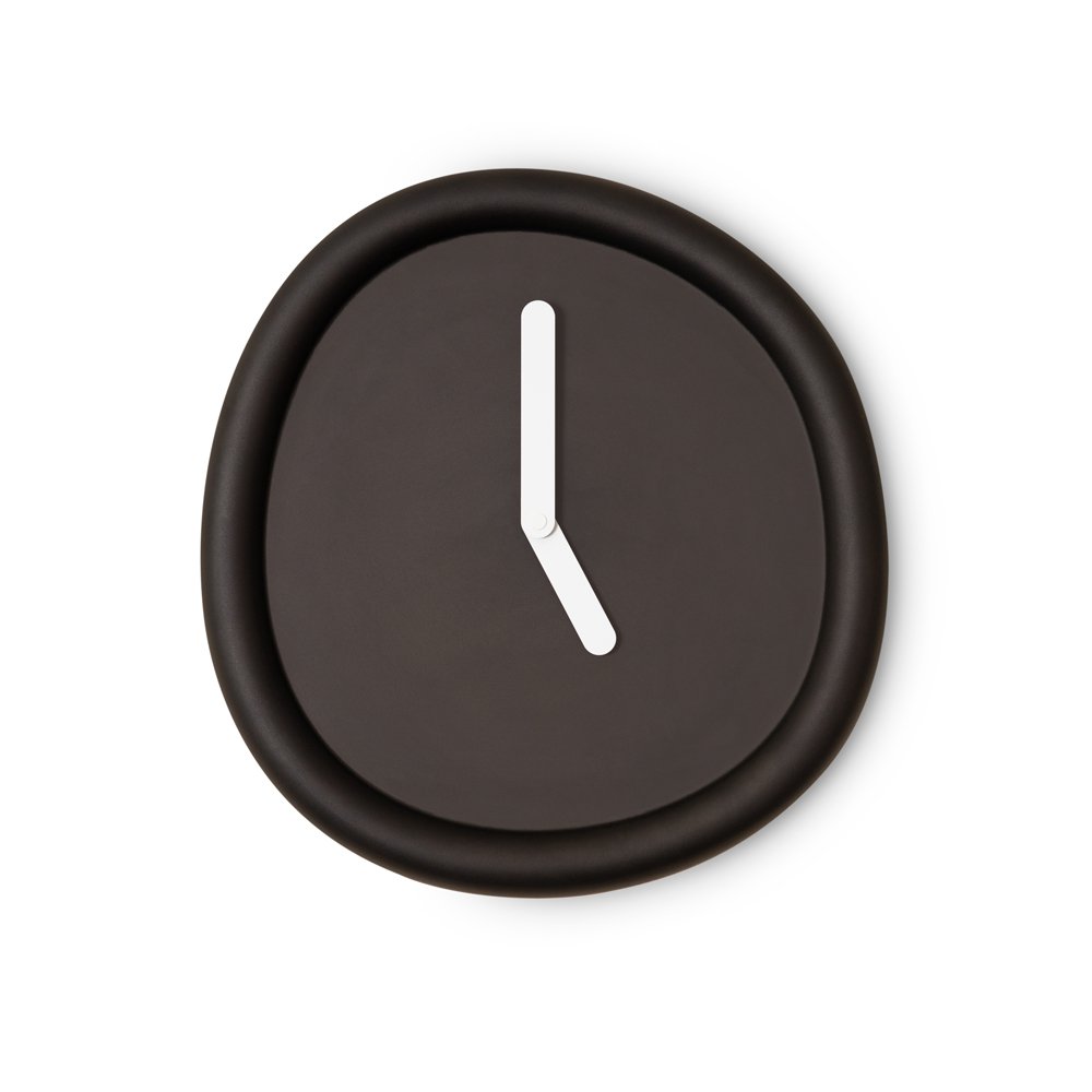 Black wall clock with a white hour hand on a white background