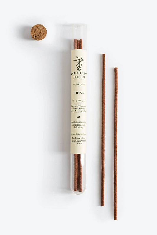 Reed diffuser with packaging on a white background
