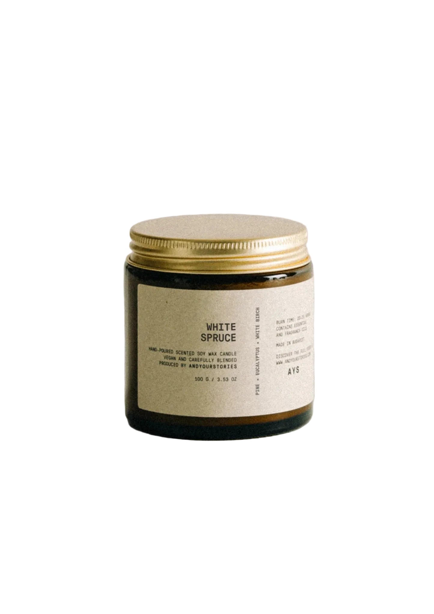 Candle with a gold lid and white label on a light gray background