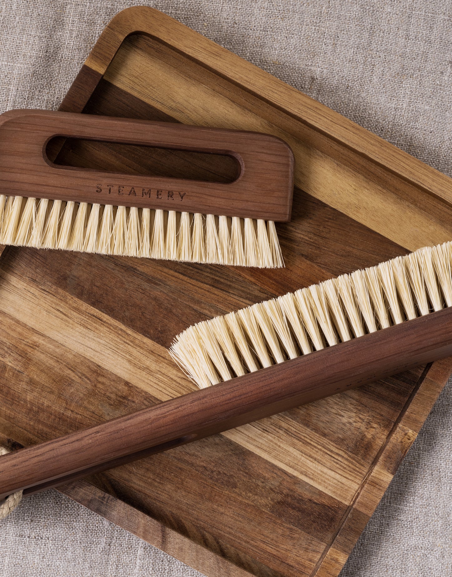 Steamery wooden fabric brush.