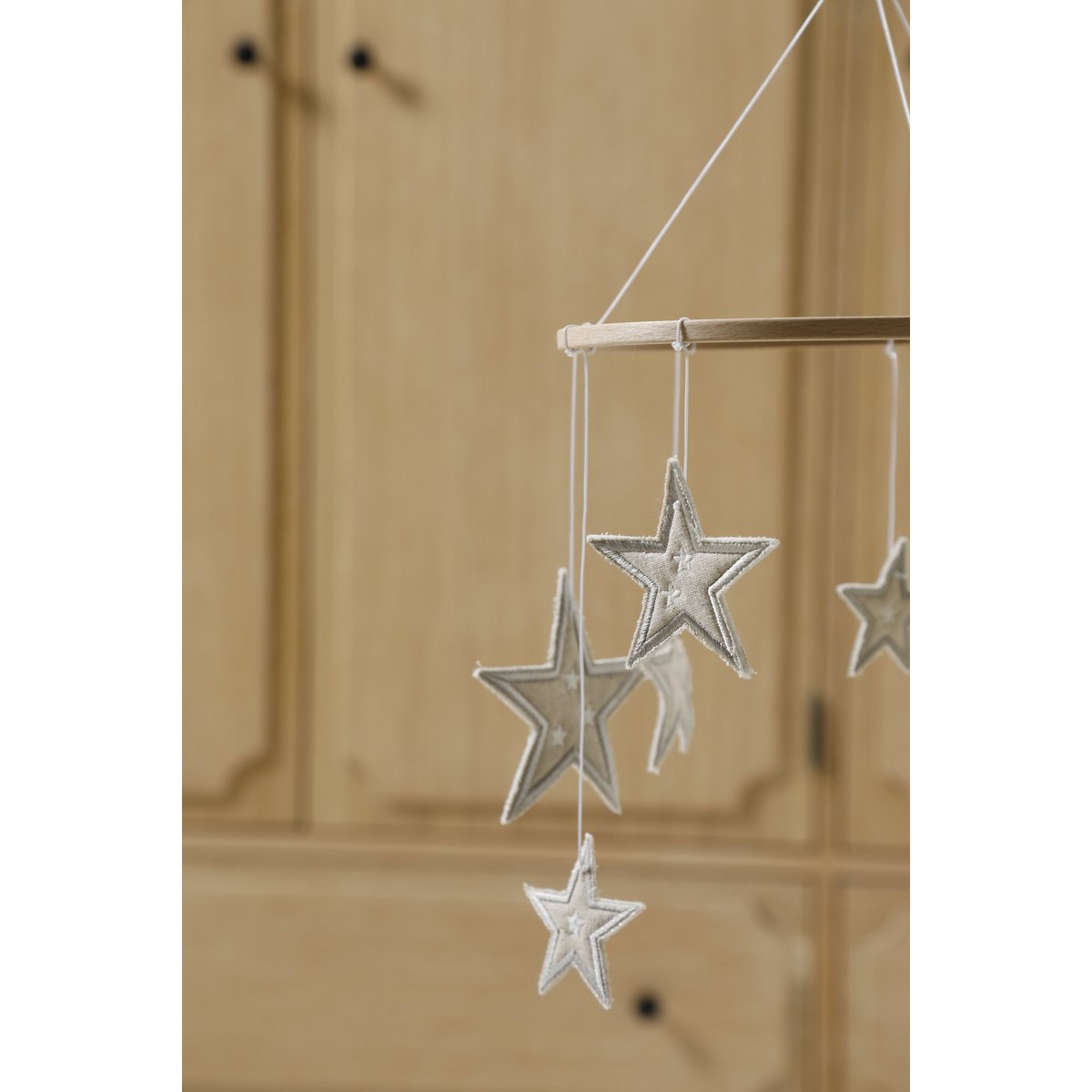 Decorative hanging stars with a wooden background