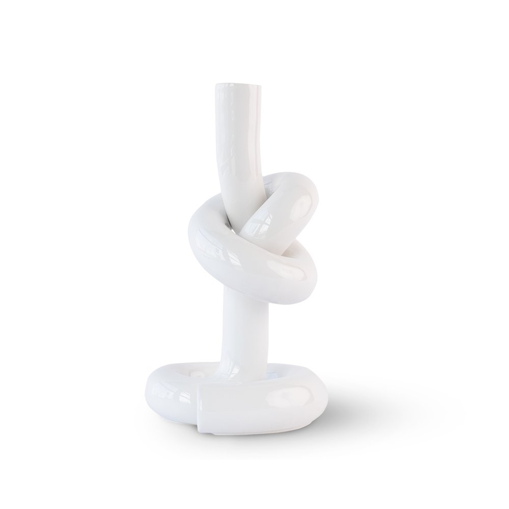 White ceramic knot-shaped candle holder on a white background