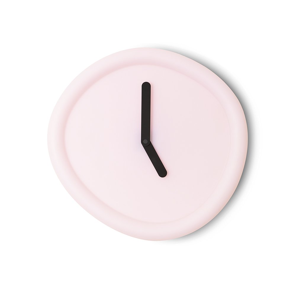 Pink wall clock with a black hour hand on a white background