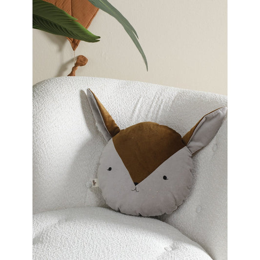 Round cushion with fox design on a white sofa