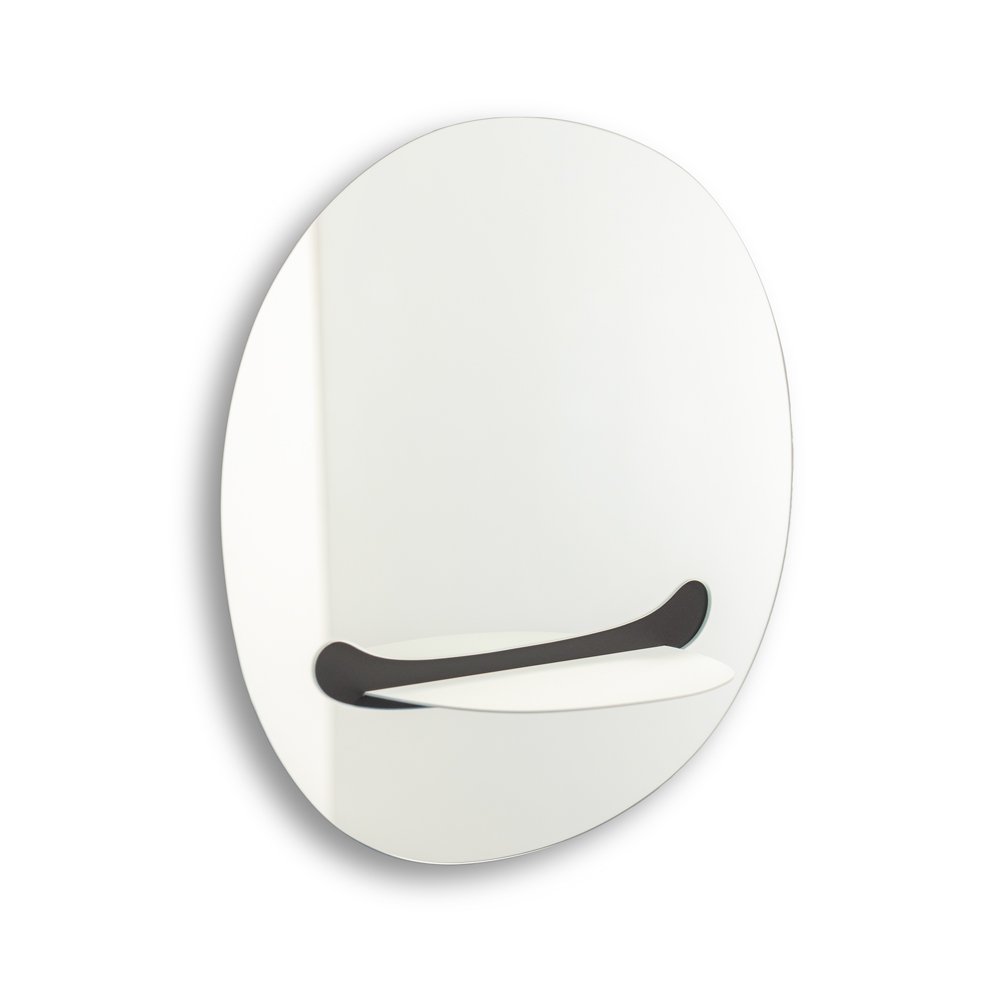 Round mirror with a black smiley face design on a white background