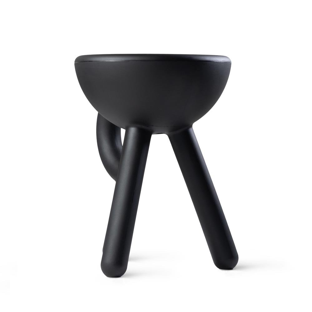 Black stool with a bowl-like seat on a white background