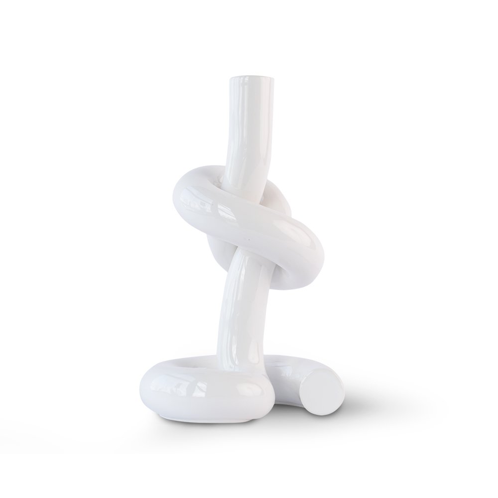 White ceramic knot-shaped candle holder on a white background
