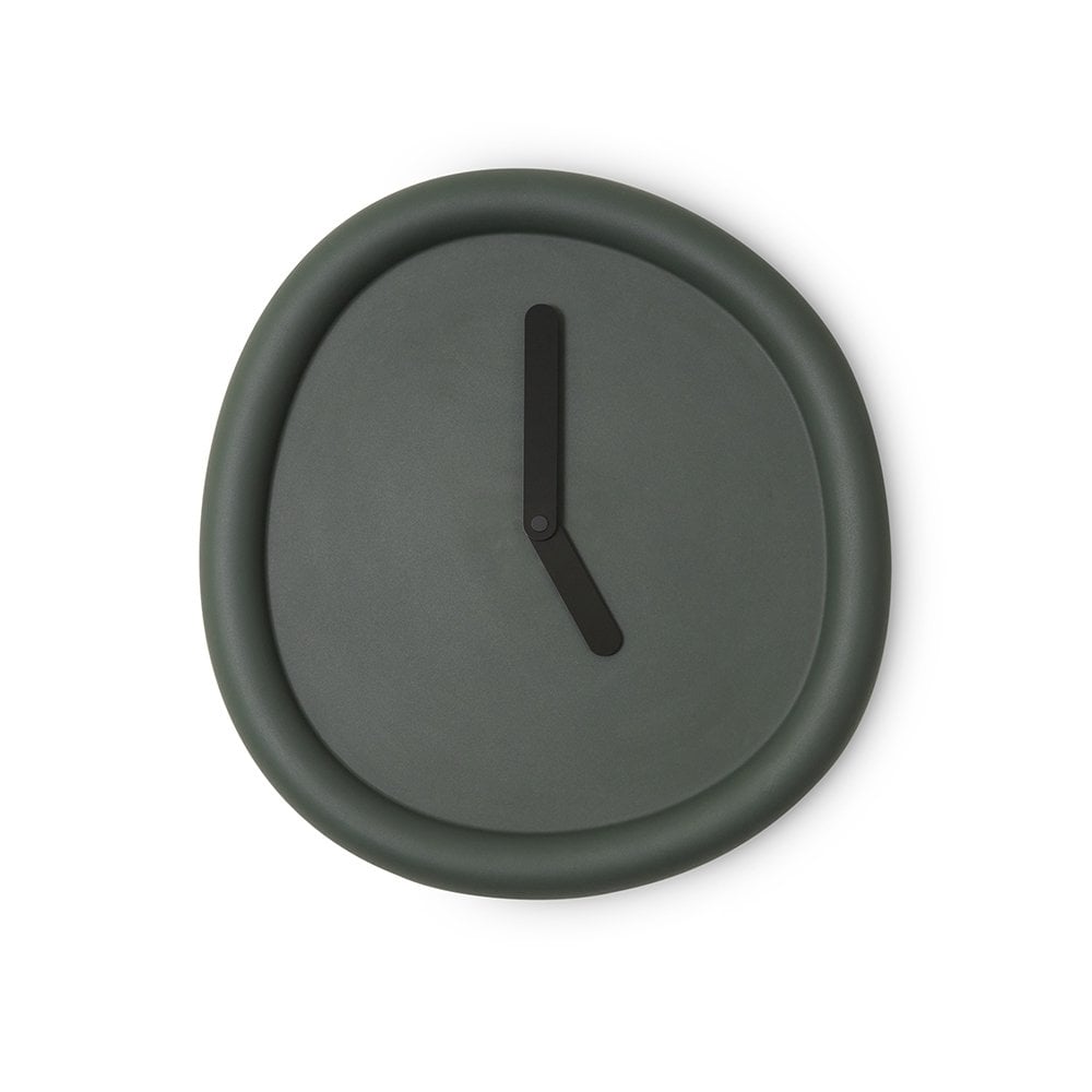 Dark green wall clock with a single black hour hand on a white background