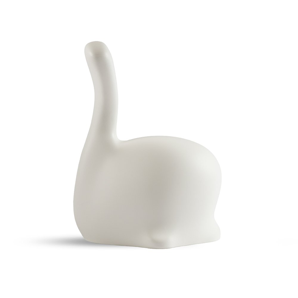 White ceramic whale sculpture on a white background