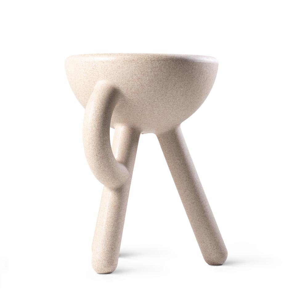 Beige ceramic stool with a unique design on a white background