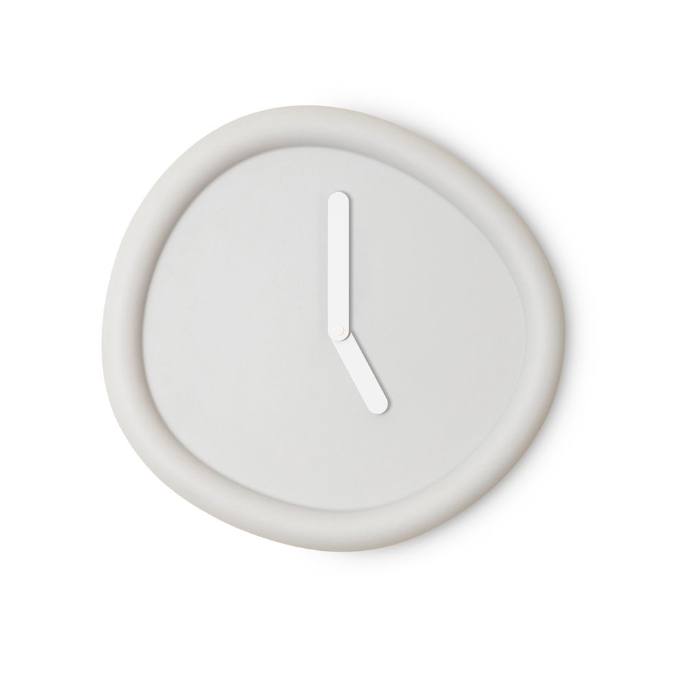 White wall clock with a single white hour hand on a white background