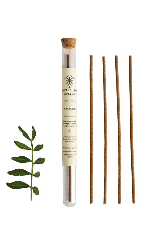 Incense stick set with a cylindrical container on a white background