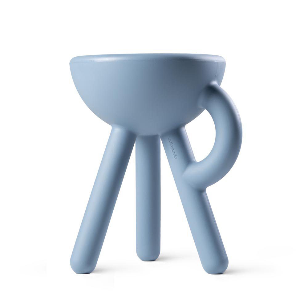 Blue ceramic cup with handle on a white background