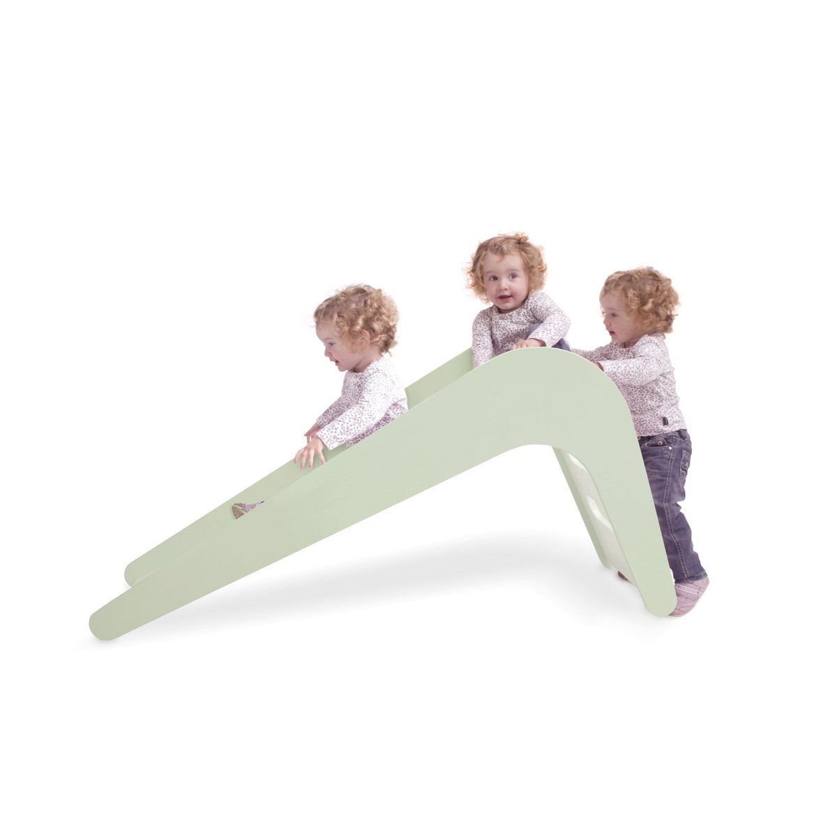 Children playing on a green slide against a white background