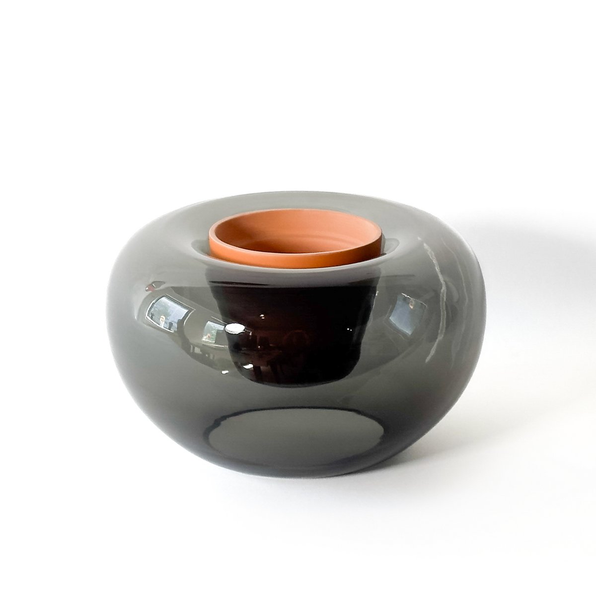 Gray and copper ceramic bowl on a white background
