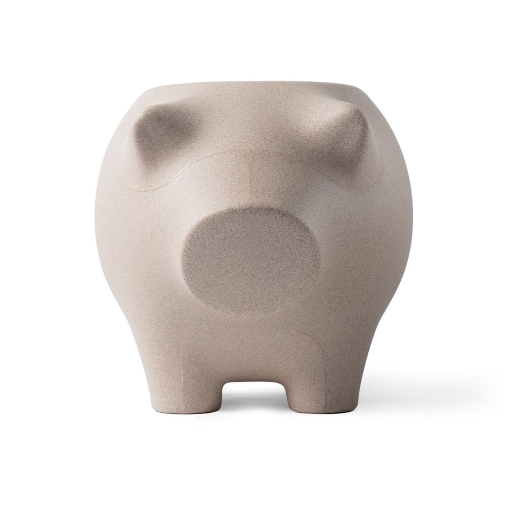 Beige ceramic elephant-shaped object on a white background