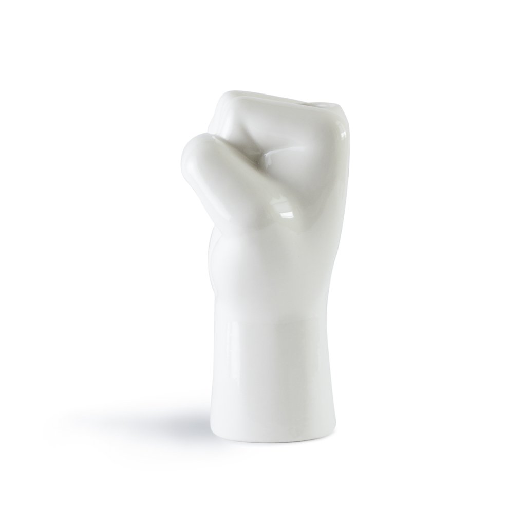 White ceramic sculpture of a hand on a white background
