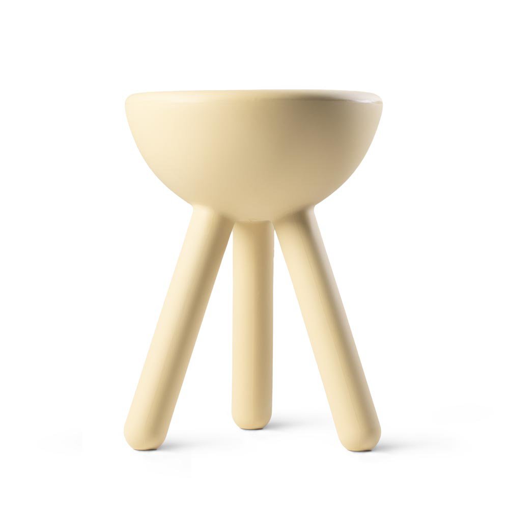 Beige three-legged stool on a white background