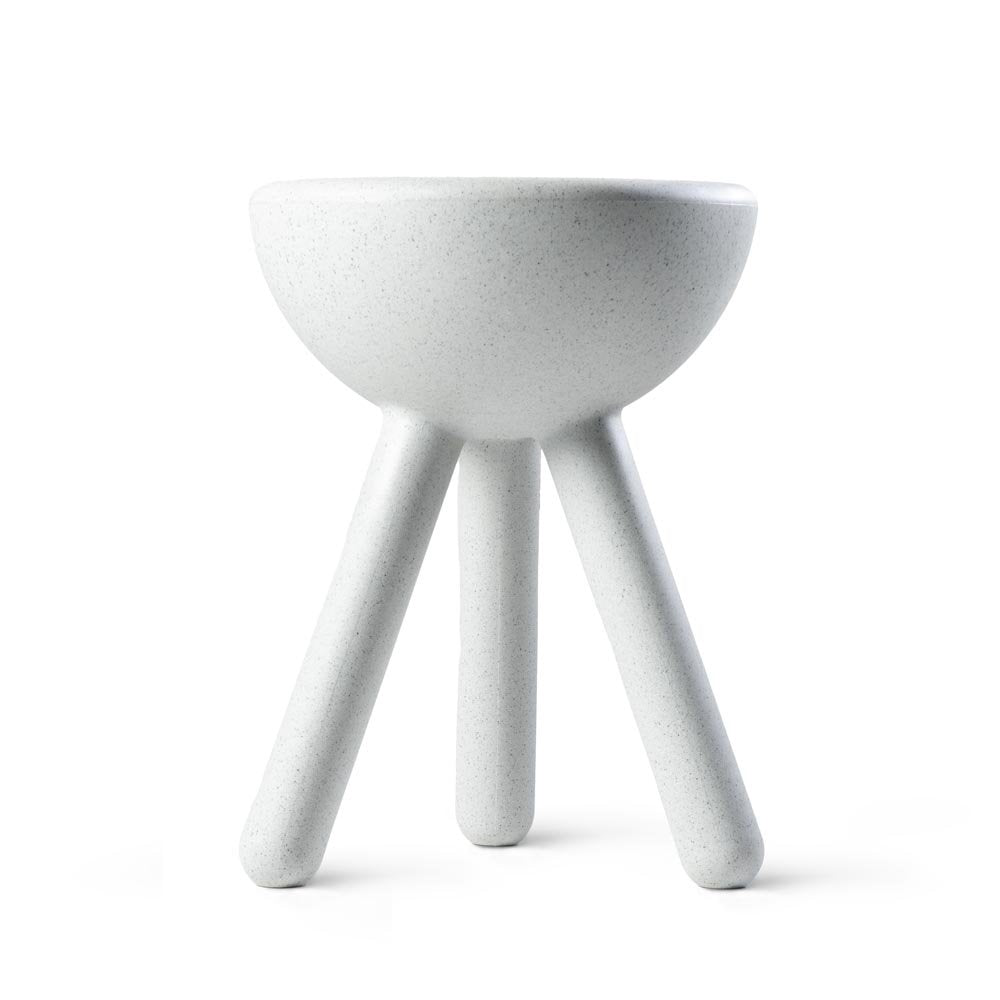 White ceramic bowl with three legs on a white background