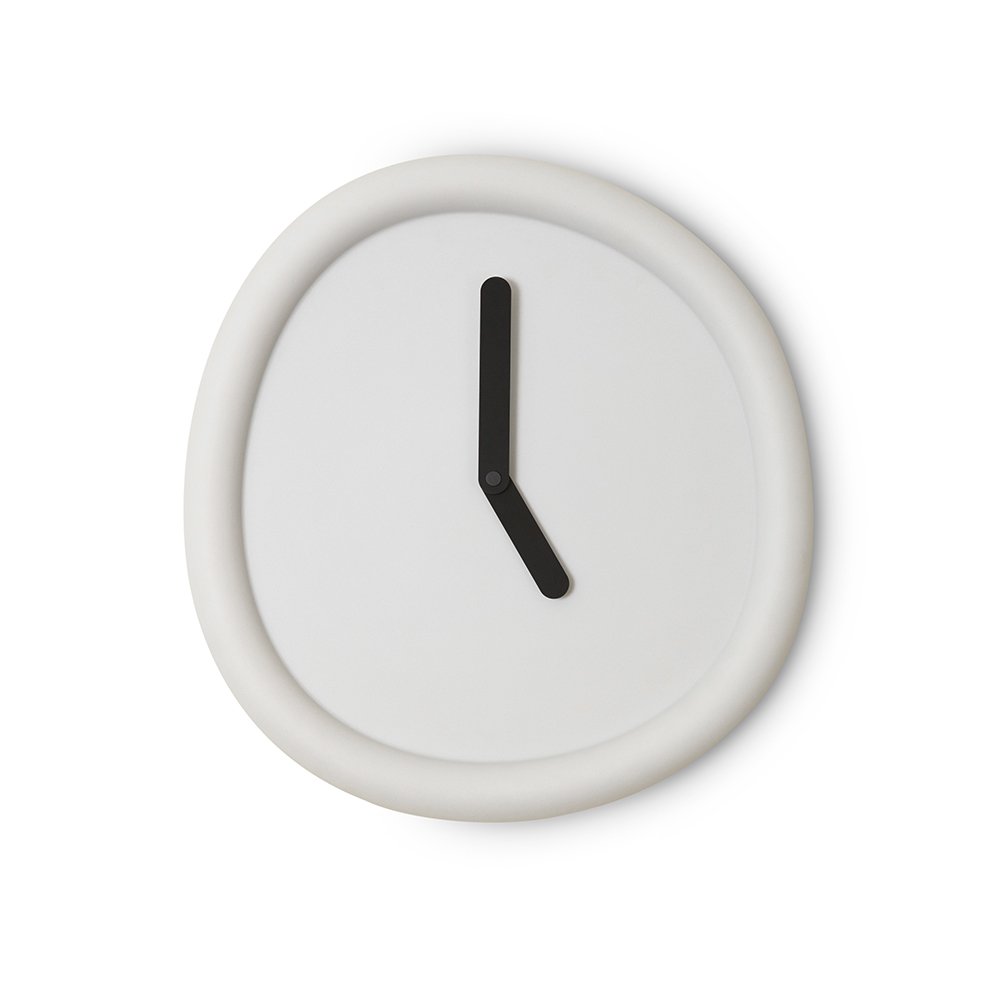 White wall clock with a black hour hand on a white background