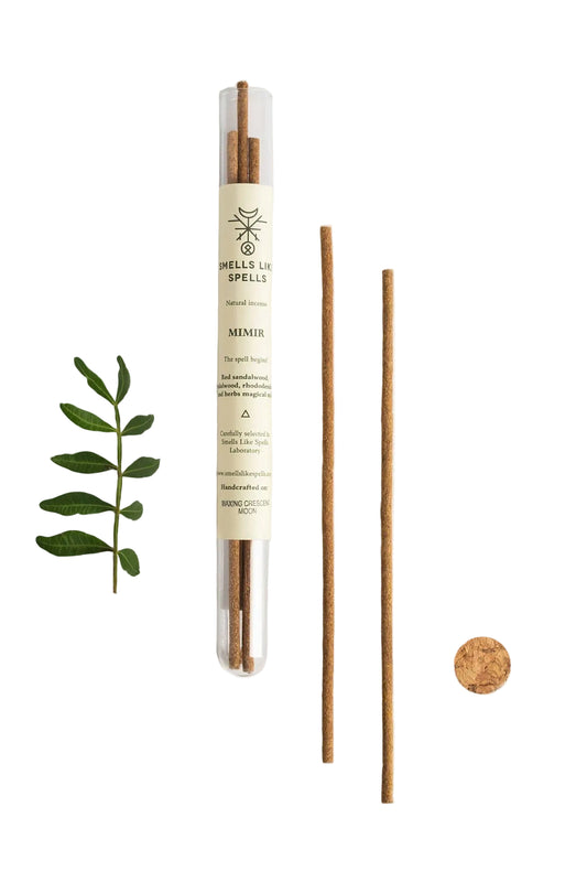 Reed diffuser with packaging and components on a white background