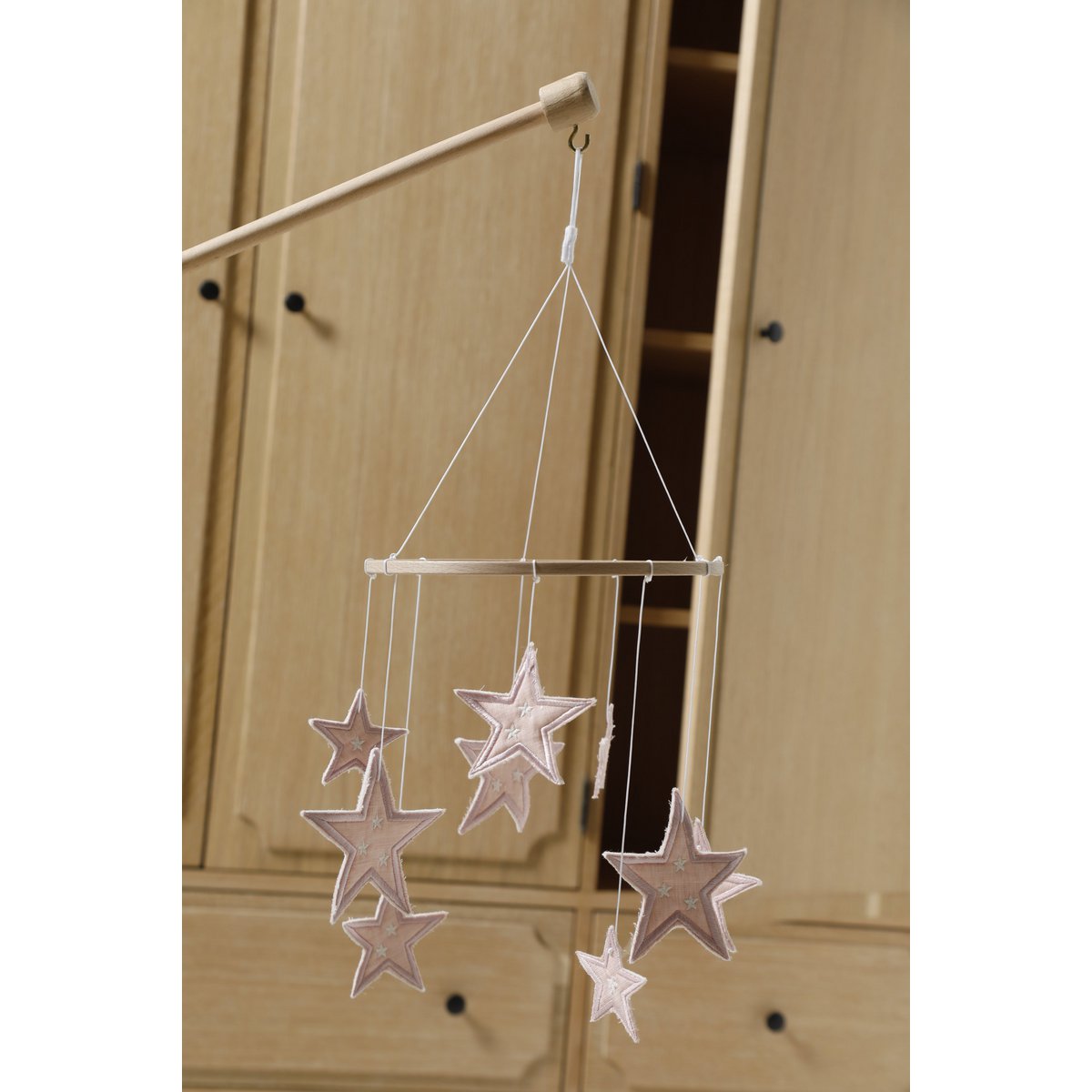 Star-shaped hanging decoration on a wooden background