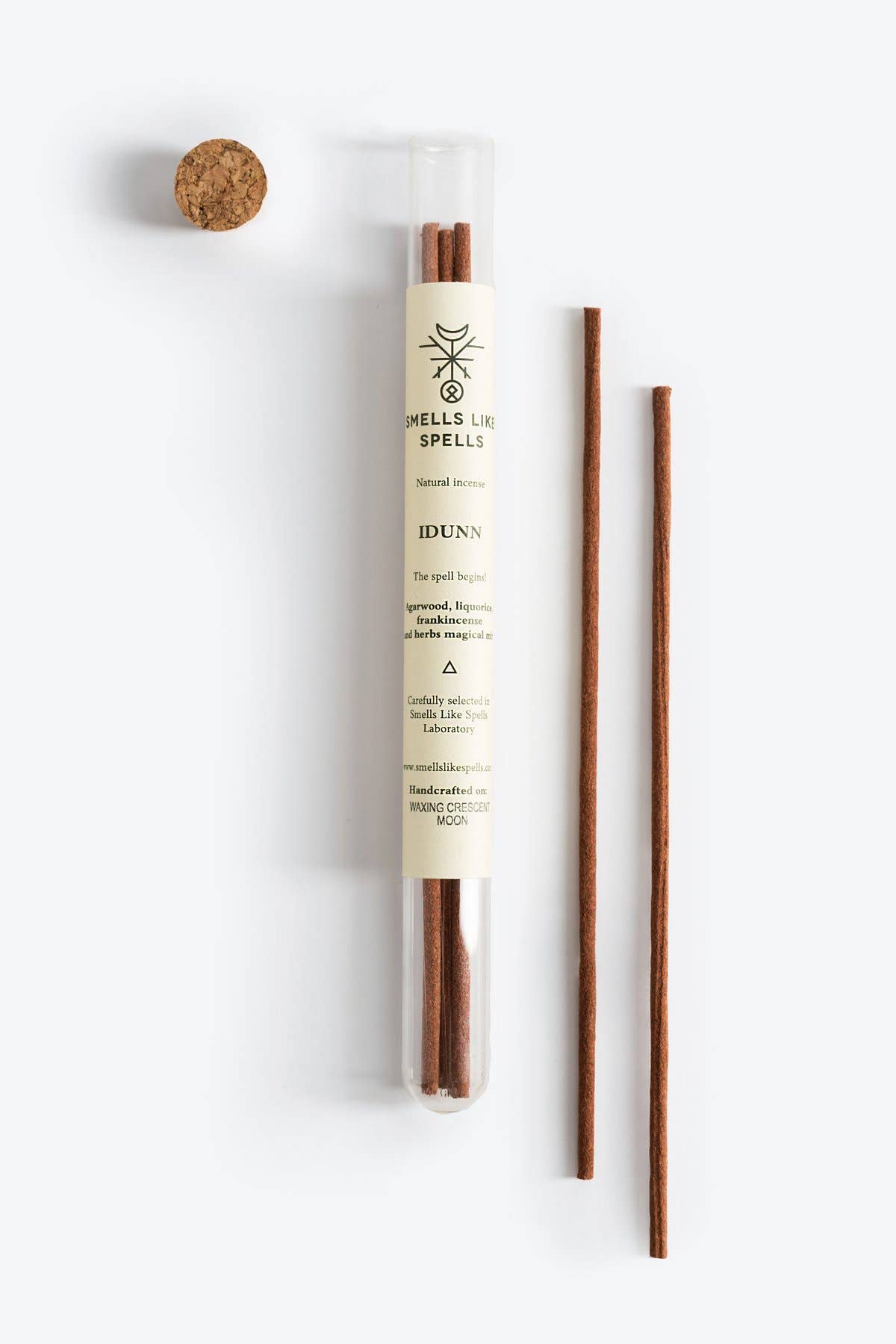 Reed diffuser with packaging on a white background