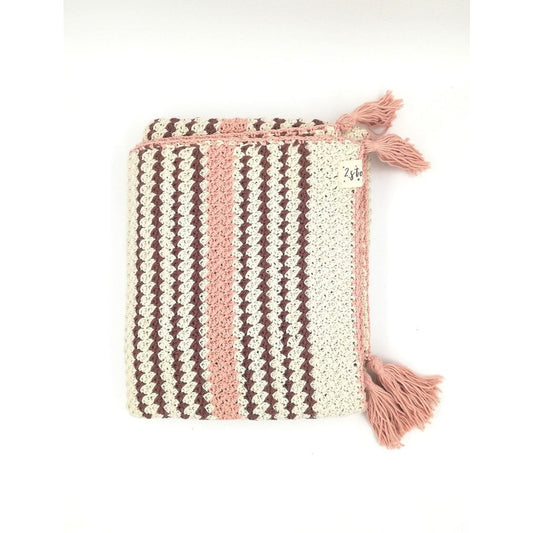 Crocheted pouch with striped pattern and tassels on a white background