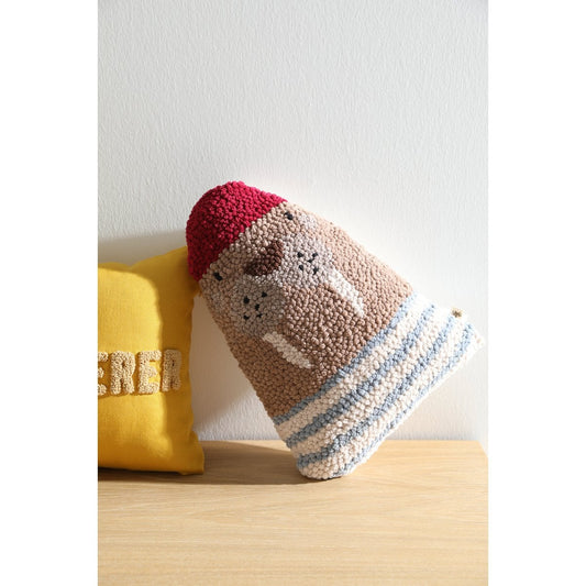Knitted hat with colorful pattern on a wooden surface
