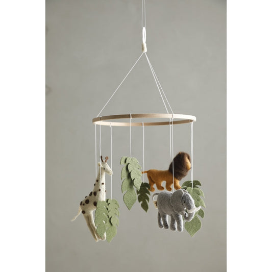 Children's mobile with animals and leaves hanging from a rod against a plain background