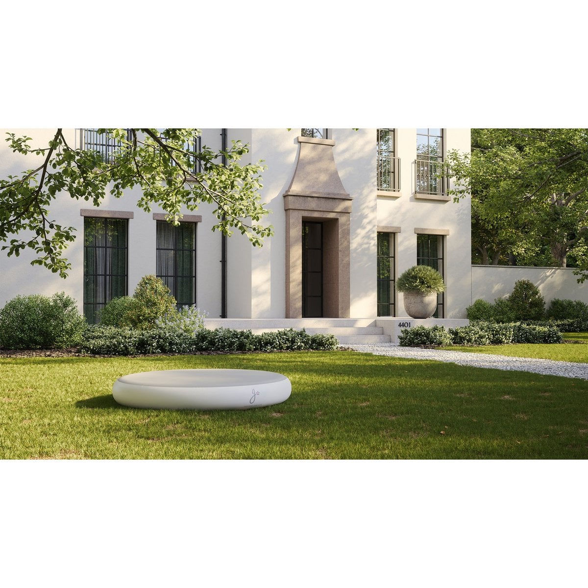 White inflatable pool on a grassy lawn in front of a large house.
