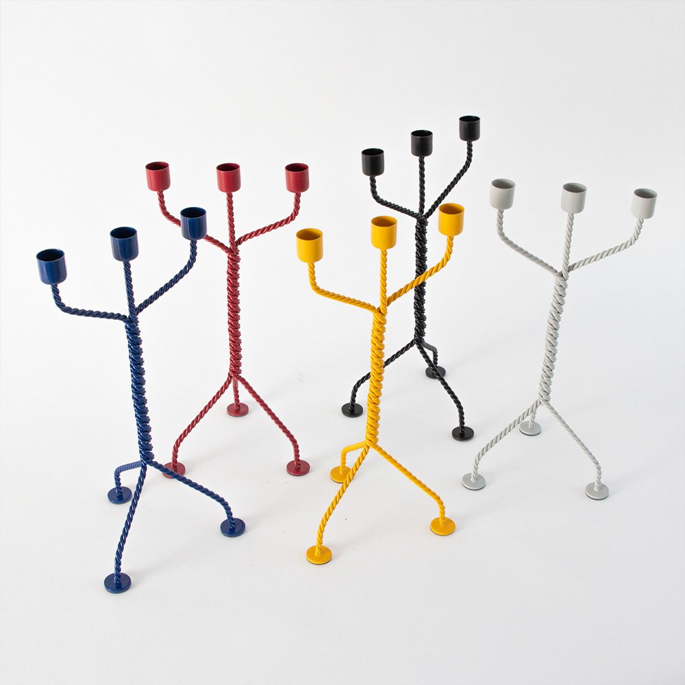 Five colorful candle holders on a white background