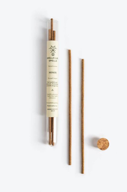 Spells & Rituals product with wooden sticks on a white background