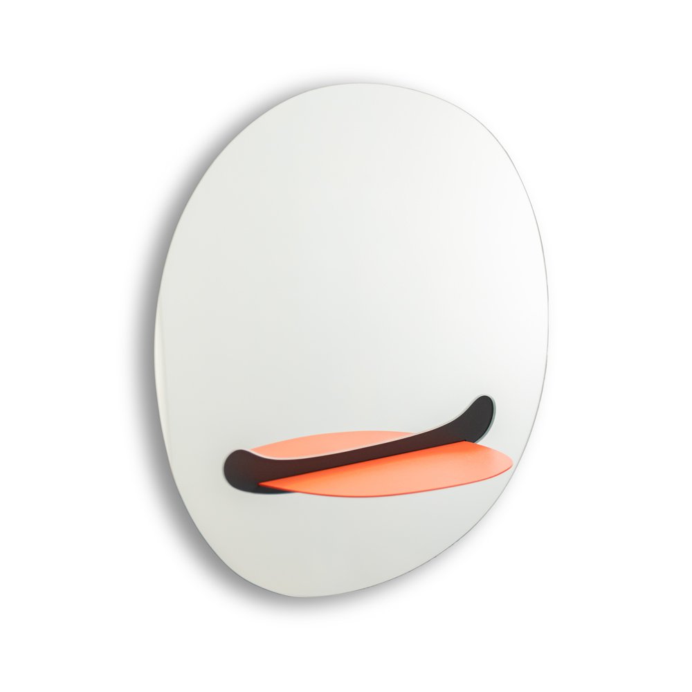 Round white object with a black and orange design on a white background