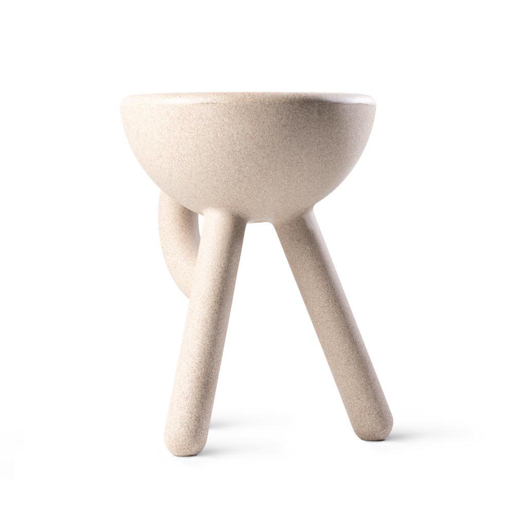 Beige ceramic stool with three legs on a white background