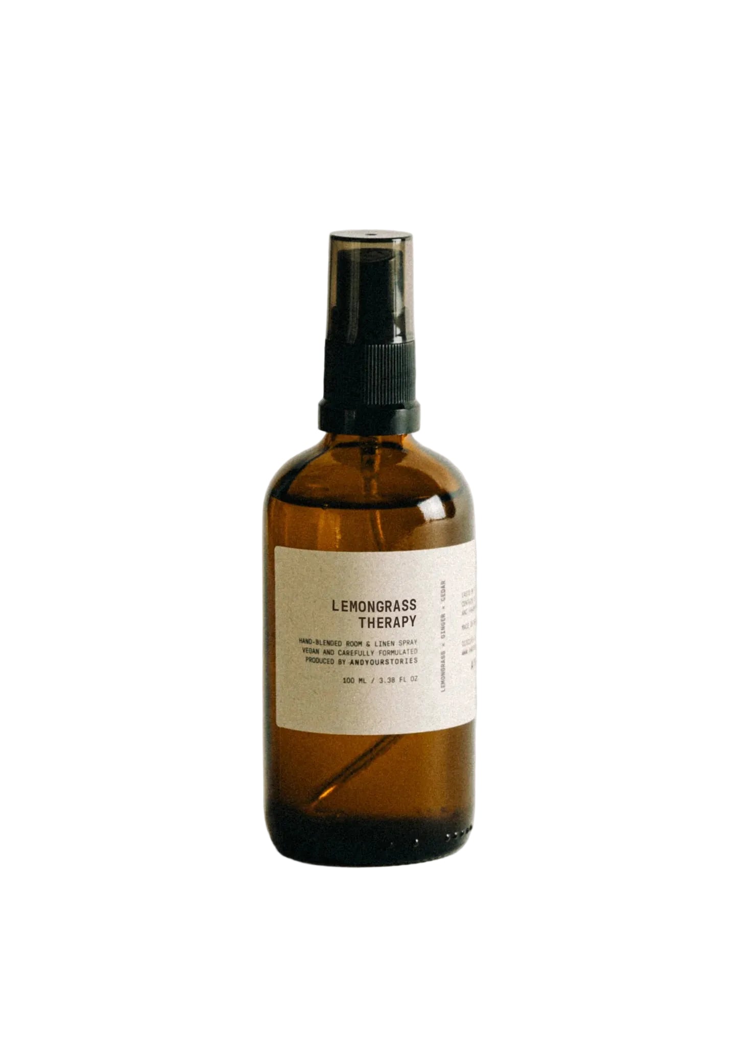 Brown spray bottle labeled 'Cashmere Woods' on a white background