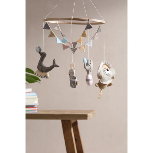 Children's mobile with hanging toys on a neutral background