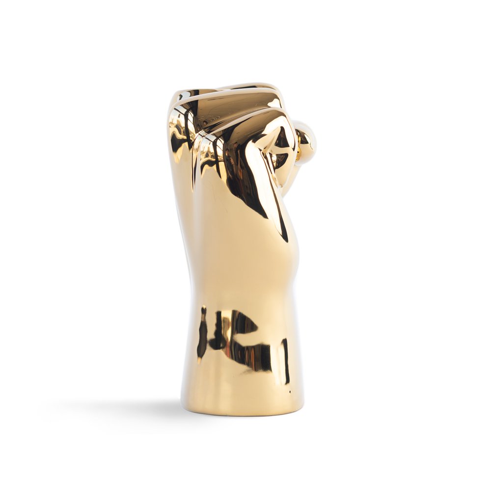 Gold-colored vase shaped like a hand on a white background