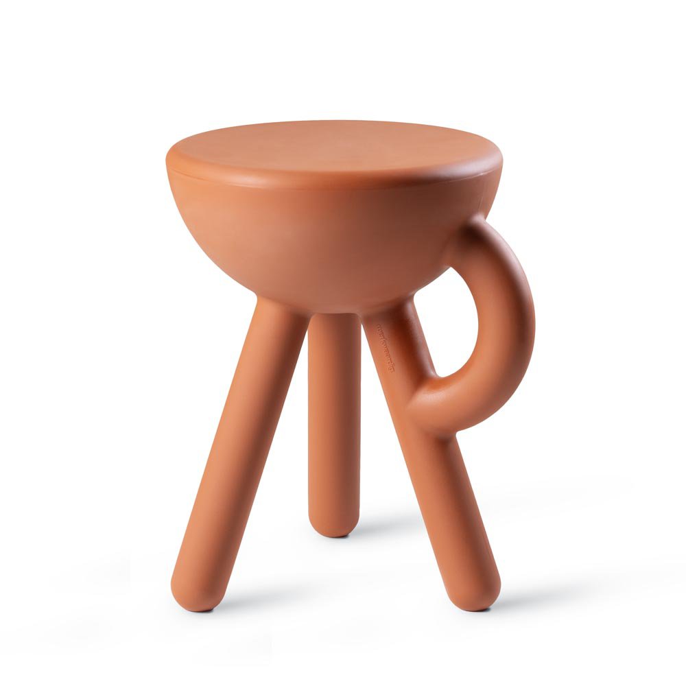 Terracotta-colored stool with a handle on a white background