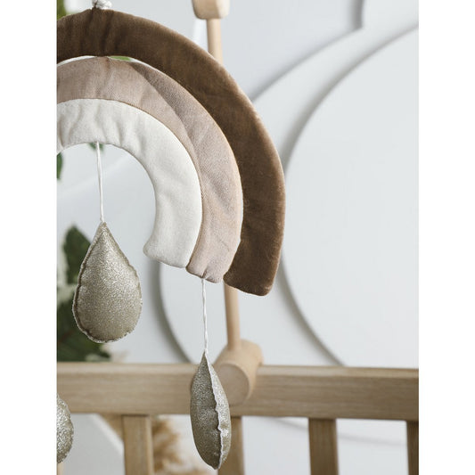 Decorative mobile with hanging elements on a crib
