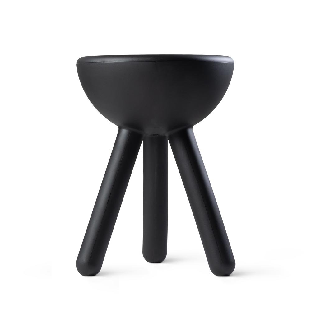 Black stool with a bowl-like seat on a white background