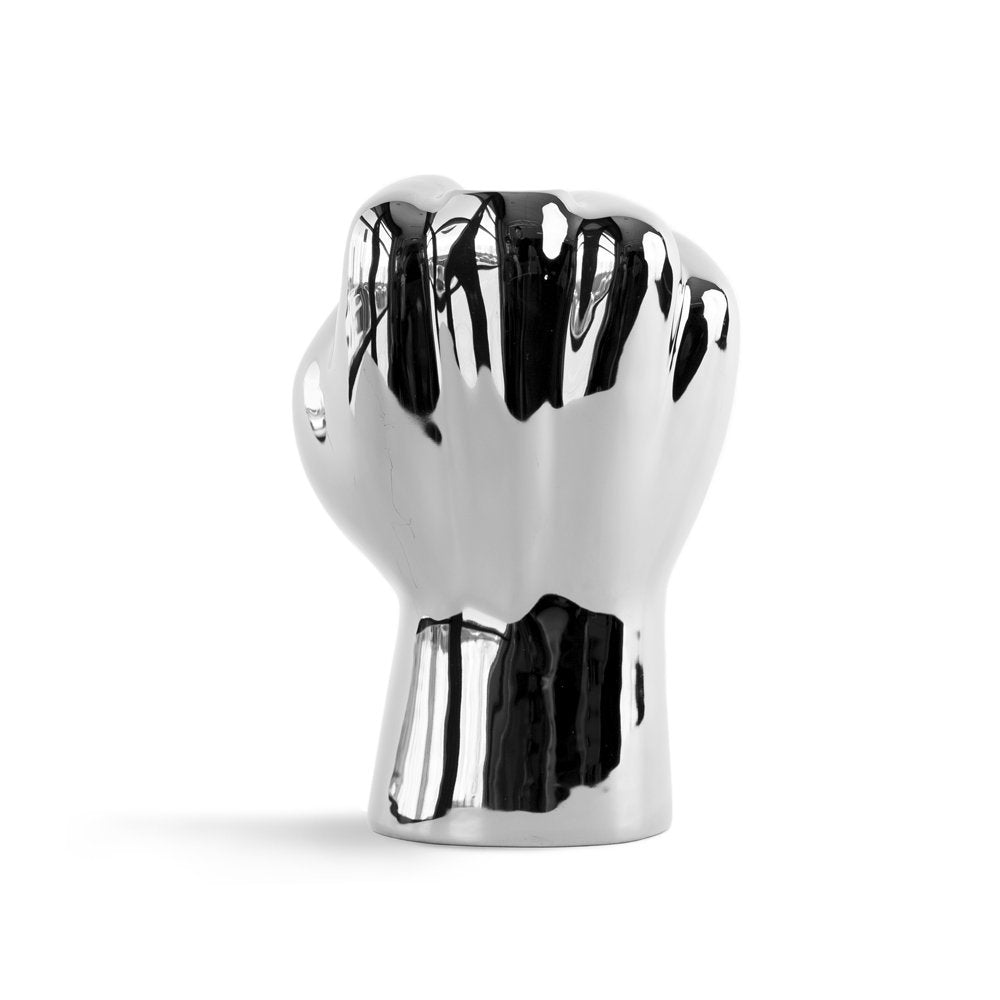 Chrome-finished fist-shaped object on a white background