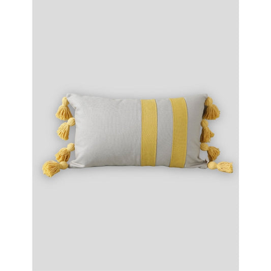 Gray pillow with yellow stripes and tassels on a light gray background