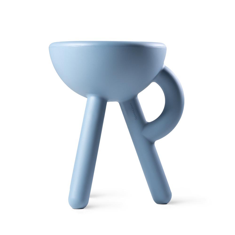 Blue ceramic cup with three legs on a white background