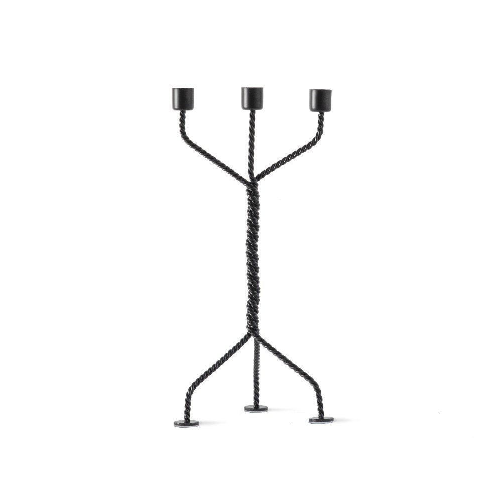 Black metal candle holder on a white background