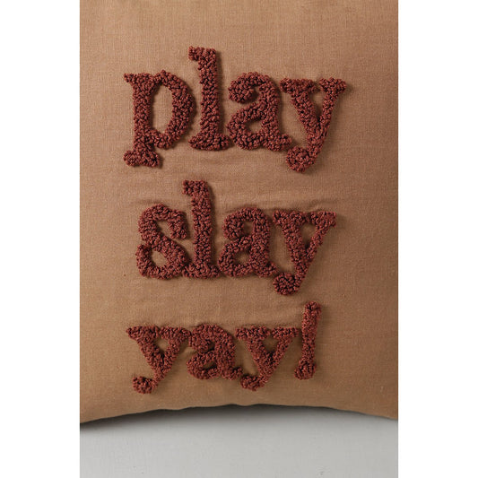 Brown pillow with 'play slay yay!' text on a white background