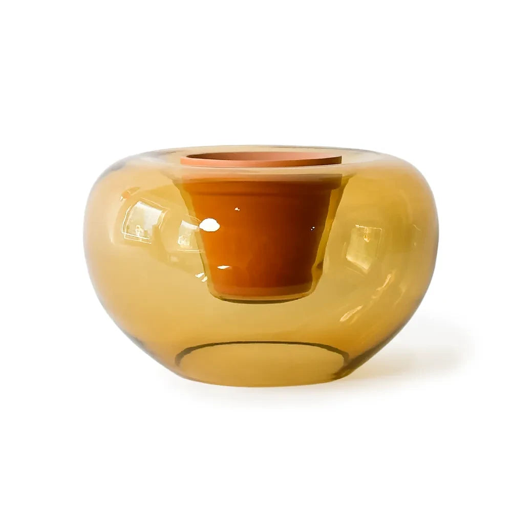 Amber glass vase on a white background