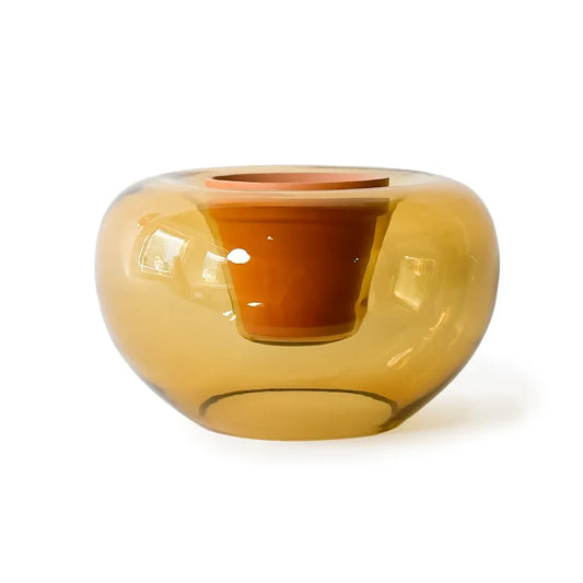 Amber glass vase on a white background